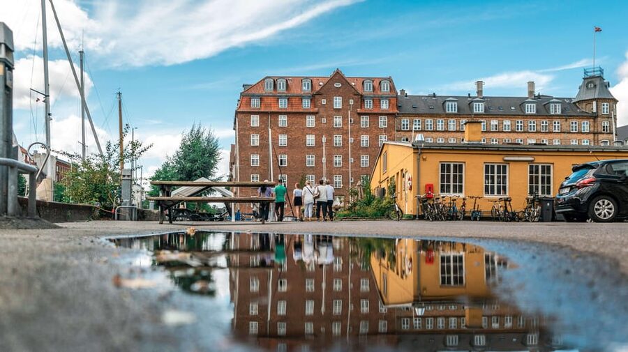 Copenhagen: 1.5-hour Private Walking Tour of Christianshavn - Nyhavn to Inderhavnsbroen to North Atlantic House: postcard to neighborhood in one arc
