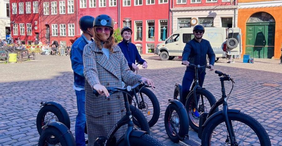 Copenhagen: Guided E-Scooter KickBike Tour- All Highlights - The old streets and canals stretch: cobblestones, church stops, and quiet corners