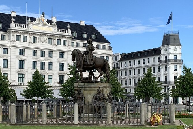 Copenhagen's Royal History: A Self-Guided Walking Tour - Nyhavn waterfront crossing, with harbor history in your ears