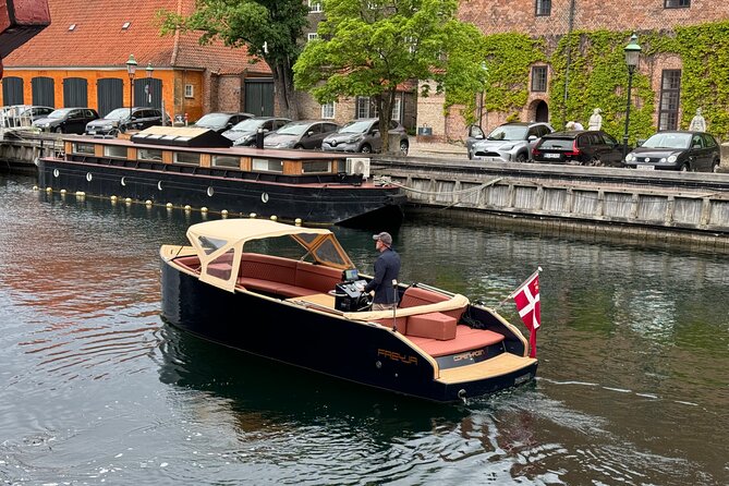 Discover Copenhagen Private Boat Tour Experience - Modern Copenhagen edges: Playhouse, Papirøen, mast houses, and cannonballs