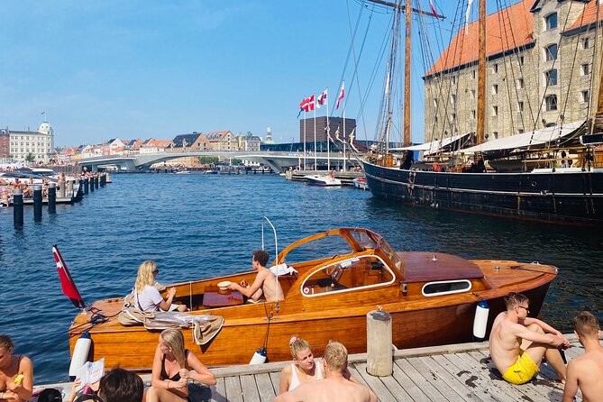 Private Copenhagen Boat cruise in Scandinavian mahogany boat - Modern Copenhagen sights: residential canals, Christiania beach, and Copenhill
