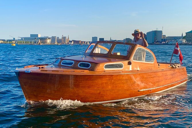 Private Copenhagen Boat cruise in Scandinavian mahogany boat - Getting your bearings at the Gammel Strand Station dock